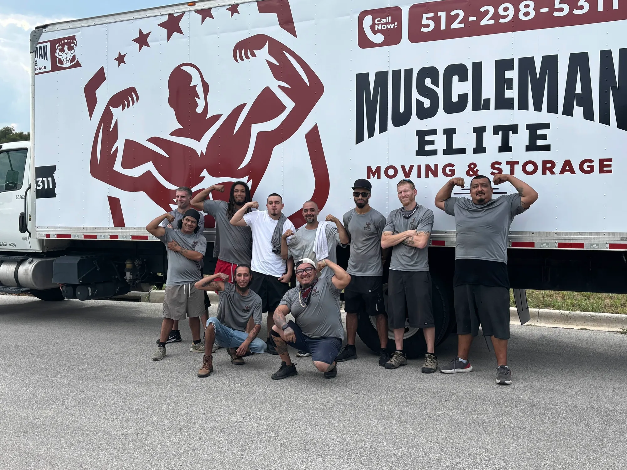The Muscleman Elite Moving & Storage crew with a company moving truck