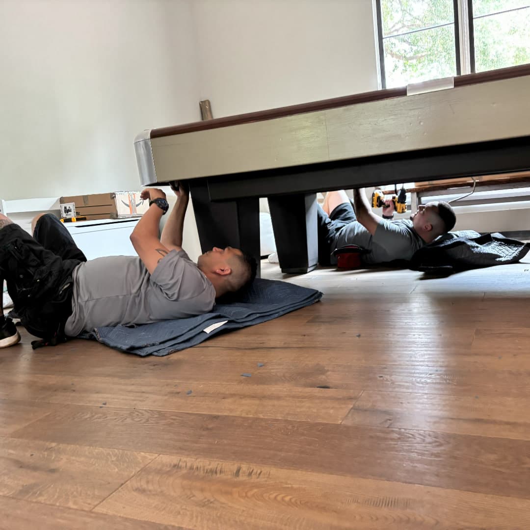 Pool table frame viewed from beneath during inspection