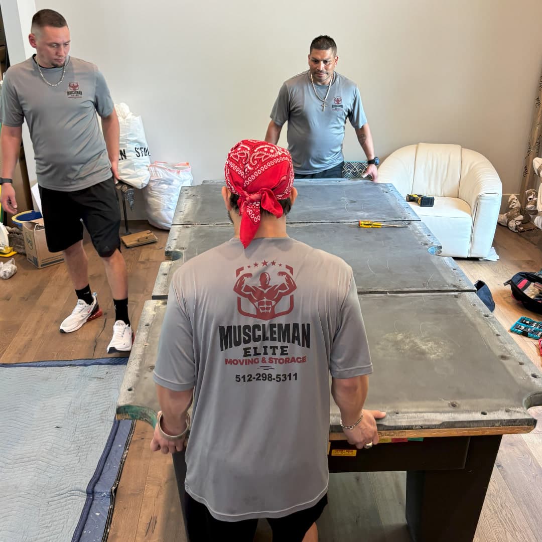 Pool table move in progress with protective wrapping