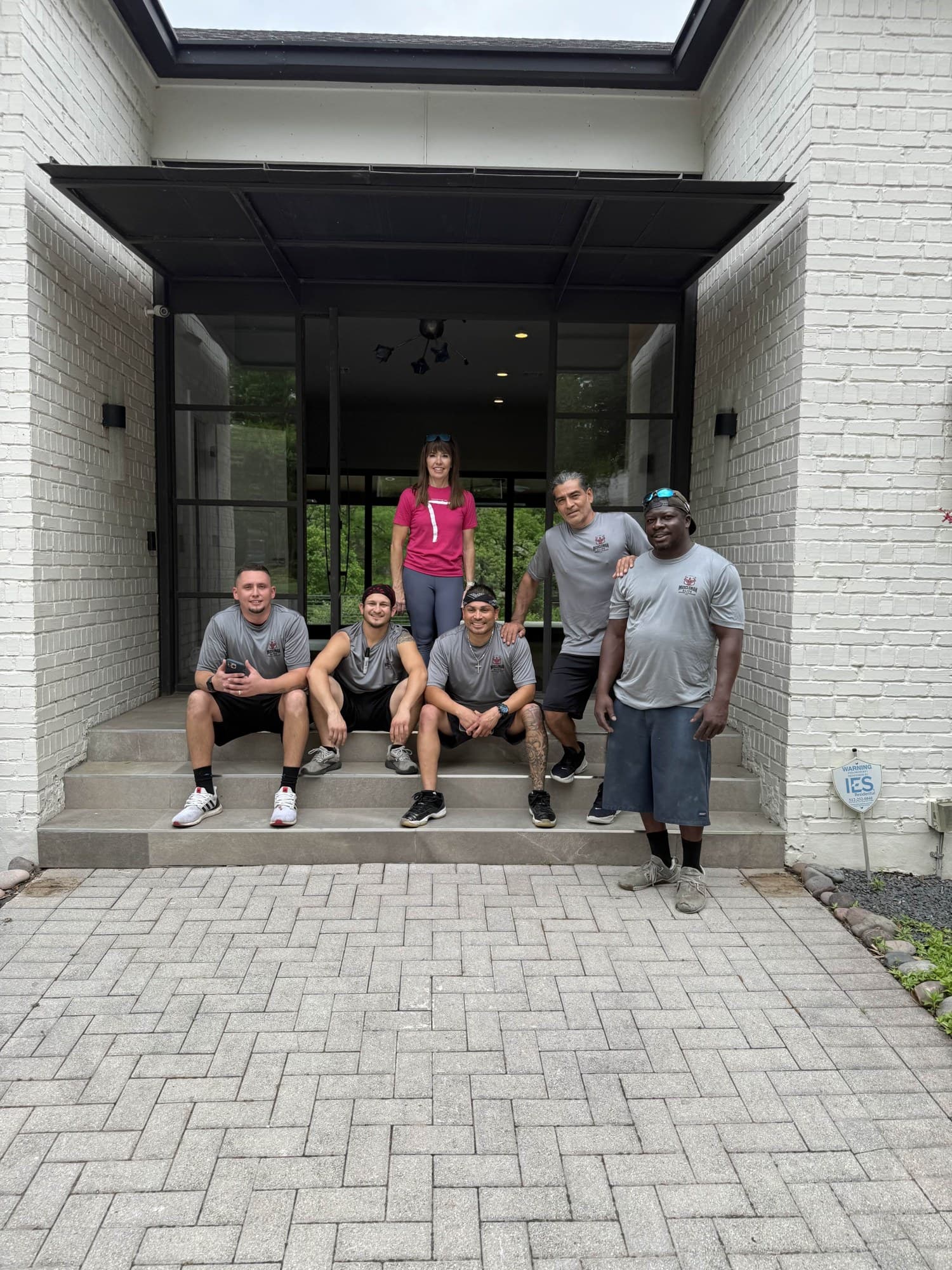 Muscleman Elite movers working outside a home on an Austin-area job
